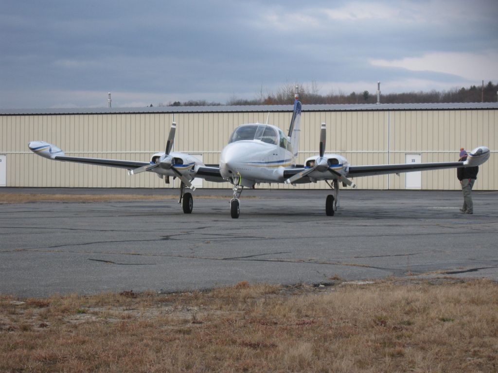 Cessna 310 (N816GH) - Parked in front of Autumn Air Services on a cold day.