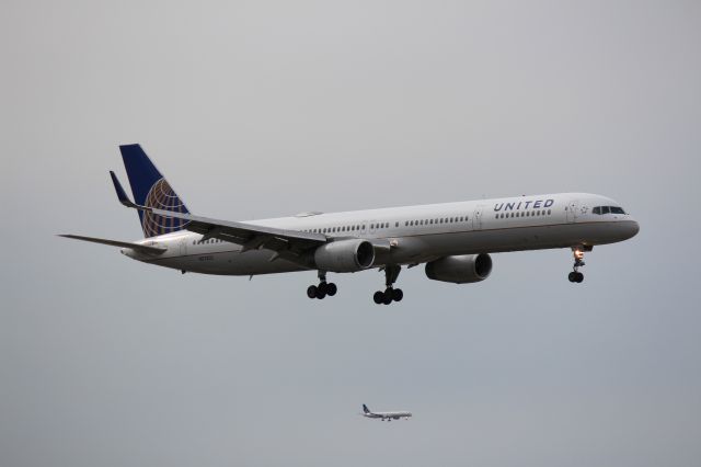 BOEING 757-300 (N57852) - Landing 10C, another company 757-300 N57855 landing on 9C in the background.