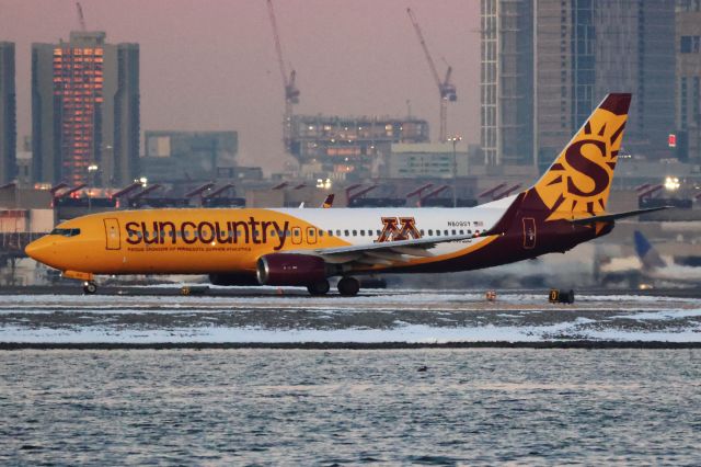 Boeing 737-800 (N809SY) - Sun Country B738 in special Minnesota Gophers livery departing BOS just before sunrise on 12/27/24.  