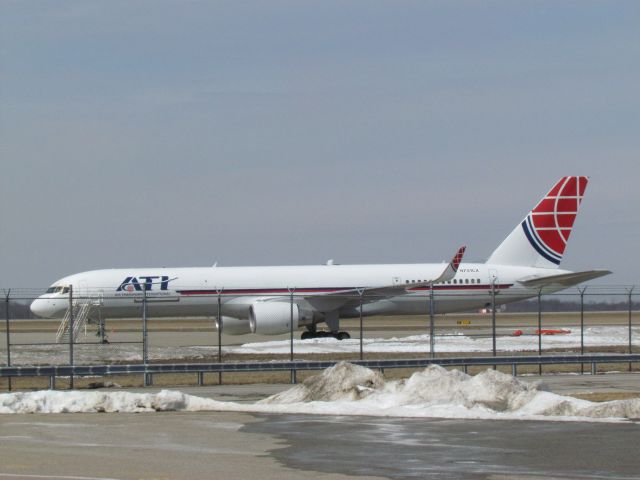 Boeing 757-200 (N751CX) - A rare Boeing 757-200 "Combi" aircraft at CVG airport. Taken from the cell phone lot