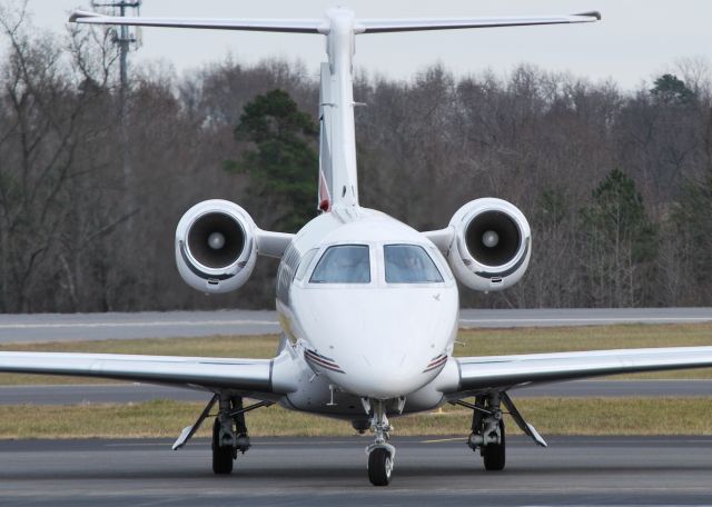 Embraer Phenom 300 (N302QS) - NETJETS at KJQF - 12/20/13