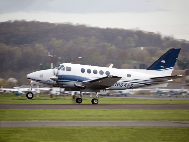 Beechcraft King Air 100 (N6045S) - Take off runway 26. The right main wheel is already off the ground.