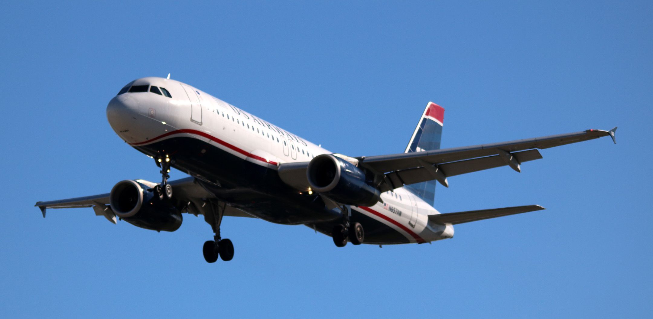 Airbus A320 (N657AW) - Awaiting repainting, AA #778 arrival landing 30L from KPHX  11-19-2015