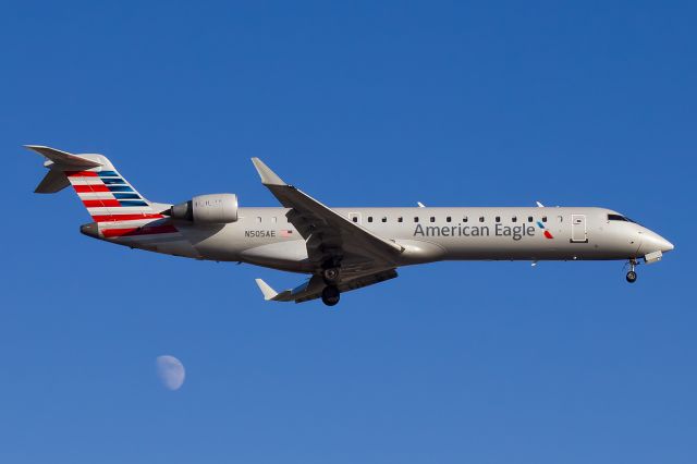 Canadair Regional Jet CRJ-700 (N505AE) - Beautiful Livery by AA, having her arrive on a clear blue sky during the golden hour and topping it off with the moon behind in the background!br /br /Full Quality: a rel=nofollow href=http://cdn-www.airliners.net/aviation-photos/photos/4/4/2/2379244.jpghttp://cdn-www.airliners.net/aviation-photos/photos/4/4/2/2379244.jpg/abr /br /Video Tutorial Editing: a rel=nofollow href=http://www.youtube.com/watch?v=i0mpFOHOXJUhttp://www.youtube.com/watch?v=i0mpFOHOXJU/a