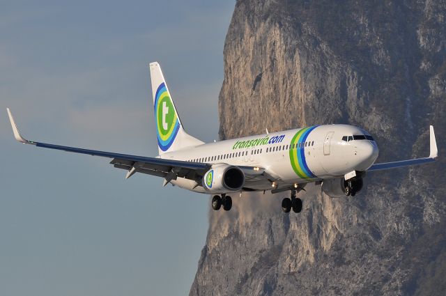 Boeing 737-800 (PH-HSW) - Passing by the Martinswand mountain on final for rwy08