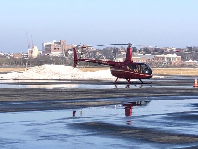 Robinson R-66 (N2266G) - On the MAC Jets FBO ramp after a three day cross-country flight from California to Maine.