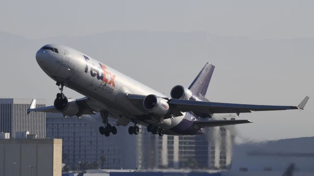 Boeing MD-11 (N602FE) - Departing lax on 25R