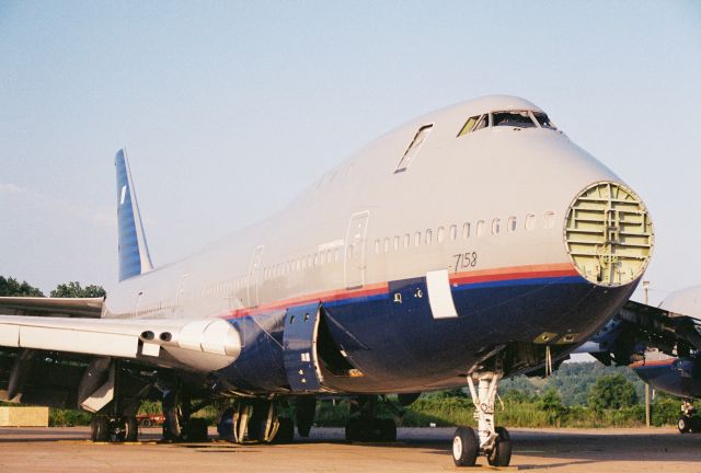 BOEING 747-100 — - A United Airlines 747 headed for the breaker - circa year 2000 at Greenwood-Leflore Airport, GWO.