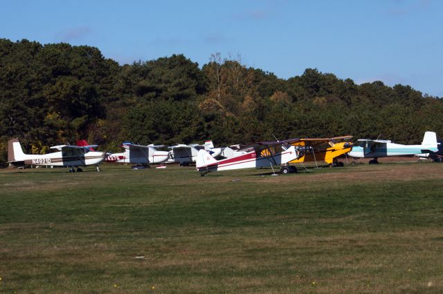 — — - A look at Cape Cod Airfield's aircraft line up on a sunny October afternoon. 