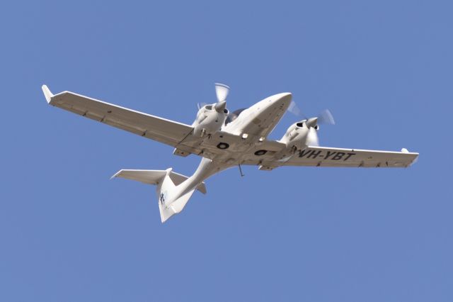 Diamond Twin Star (VH-YBT) - A Flight Training Adelaide DA42 flying over the runway 23 planespotting park. 