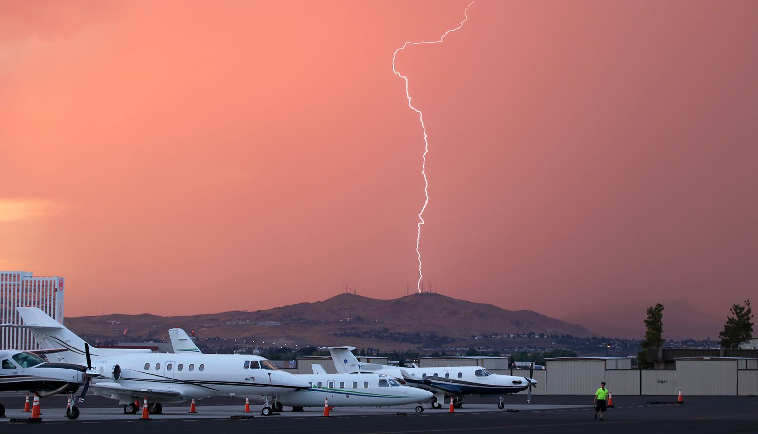 — — - Rain is obscuring the hills north of the airport as a storm moves toward RNO. Shortly after this photo was taken, severe wind sheer at both ends of runways 16R-34L and 16L-34R forced the airport to close for about 30 minutes or so.