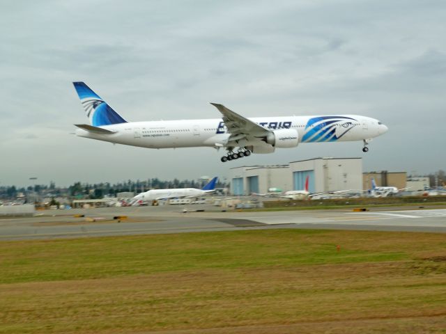 BOEING 777-300 (SI-GDP) - Photo of EgyptAir Boeing 777-300ER, coincidentally taken on 2-11-2011 in Everett, WA, the same day that Hosni Mubarak resigned (VP of Egypt from 1975 to 1981, President from 1981 to 2011)