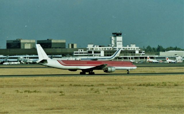 McDonnell Douglas DC-8-70 (N961R) - KSEA - Ex Emery Worldwide Freight landing Seattle taken from one of the best viewing areas on the west coast back then( now closed) N961R used to be at San Jose quite often mid 1980s. This photo I took XD-11 300mm. Apprx early 1990s?