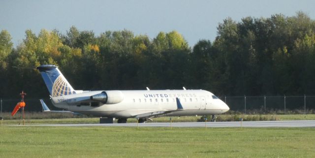 Canadair Regional Jet CRJ-200 (N986SW) - Taxiing for departure to Washington D.C. is this 2004 United Express Canadair Regional Jet 200ER in the Autumn of 2021.