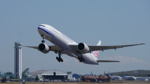 BOEING 777-300 (B-18002) - CAL1710 climbs from Rwy 34L beginning its delivery flight to RCTP / TPE on 6/30/15. (ln 1307 / cn 43980).