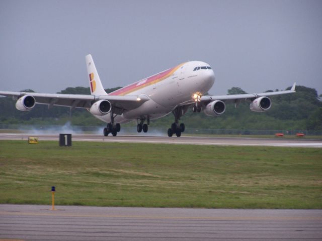 Airbus A340-300 (EC-LMH) - EC-LMH becomes the very first A340 to visit Providence/TF Green on June 1st 2011 Here Hotel Mike touches down on runway 23