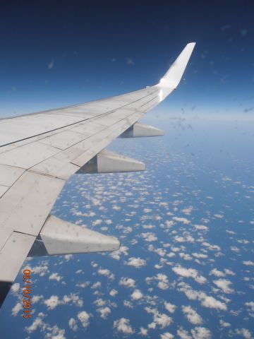 Boeing 737-800 (VH-YOP) - Virgin Australia Boeing 737-800 from Perth Airport to Denpasar. Over the humid air near Indonesia.