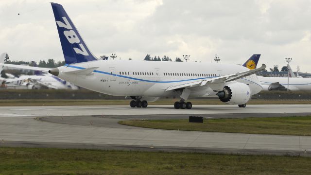 Boeing 787-8 (N787FT) - BOE005 - B787-8 begins it takeoff roll on runway 16R. Photographed 10/6/11.