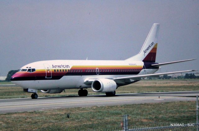 BOEING 737-300 (N308AC) - San Jose,CA  SJC late 1980s photo of an ex Air Cal in American Airline hybrid  colors. This aircraft arriving from a flight from southern California.