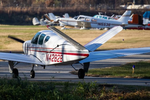 Beechcraft 35 Bonanza (N4282B) - N4282B turning off of College Park Airport's runway 15 