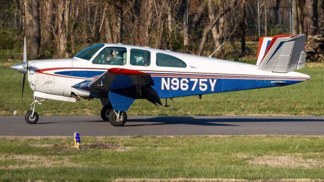 Beechcraft 35 Bonanza (N9675Y) - N9675Y slowing down on College Park Airport's runway 33 during golden hour 