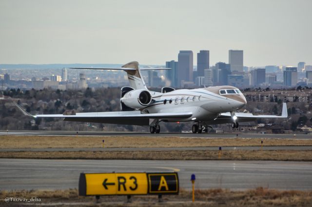 GULFSTREAM AEROSPACE G-7 Gulfstream G600 (N831FR) - Taxiway R3 with this G600 landing in front of the Denver Skyline.