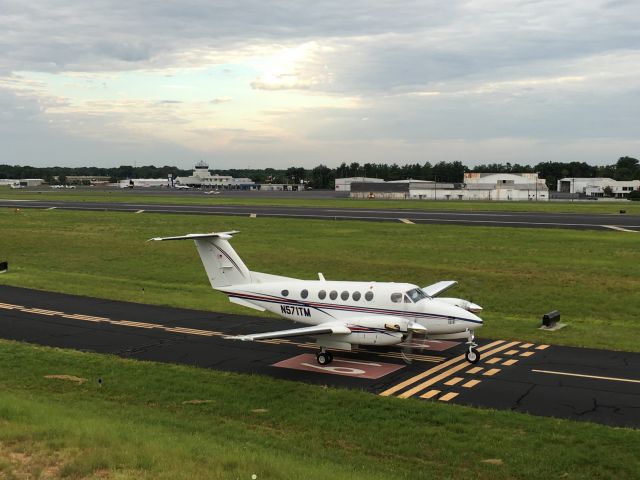 Beechcraft Super King Air 200 (N571TM) - Greenville Jet Center in the background.