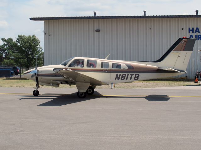 Beechcraft Baron (58) (N81TB) - A very nice pressurized Baron. Note the cabin door on the left side.