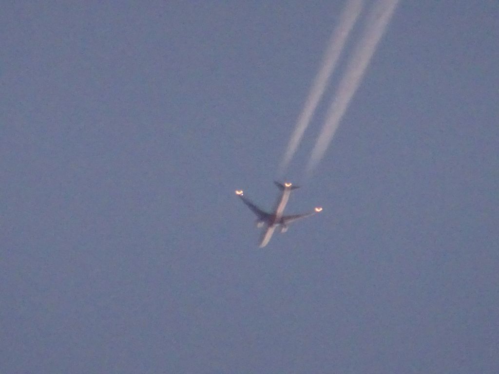 BOEING 777-300 (A6-ENE) - Emirates to Dallas-Fort Worth over Fargo at dusk 
