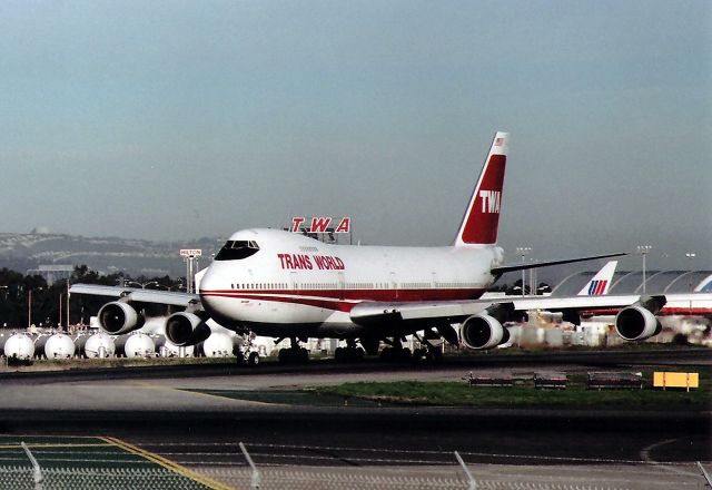 Boeing 747-200 (N305TW) - KSFO - Classic TWA taxi to 1 R at SFO - the TWA cargo building is still there, but no titles. Sorry to post 2-3 same jet pictures but worth it.