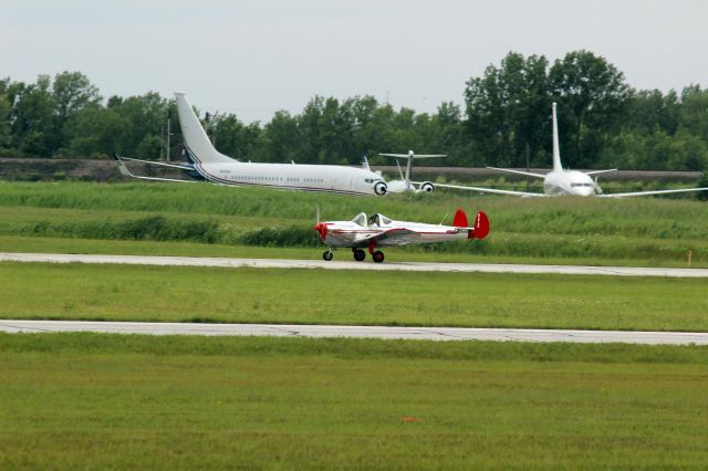 ERCO Ercoupe (N2679H) - Taking off on RWY 20 with a couple of BBJs in the background