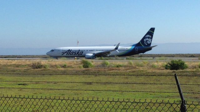 Boeing 737-800 — - Alaska Boeing 737-800 turning off of the runway unusually late.