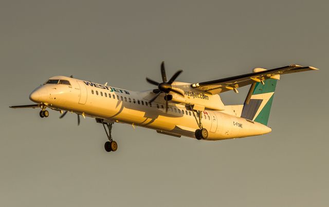 de Havilland Dash 8-400 (C-FOWE) - Catching the first rays of sun, short finals for runway 23