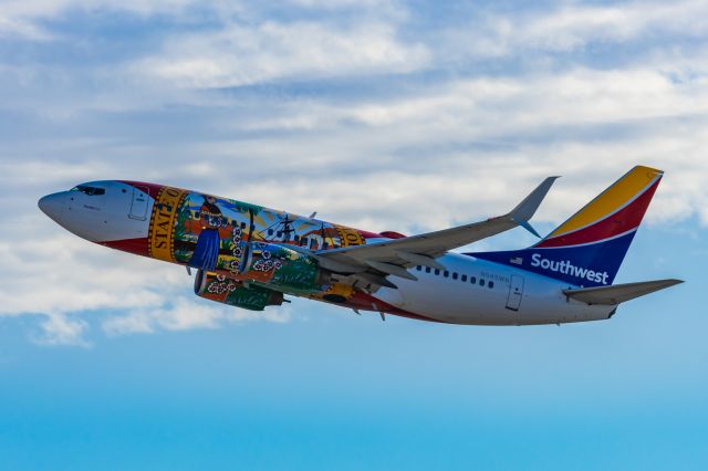 Boeing 737-700 (N945WN) - A Southwest Airlines 737-700 in Florida One special livery taking off from PHX on 2/12/23 during the Super Bowl rush. Taken with a Canon R7 and Canon EF 100-400 II L lens.