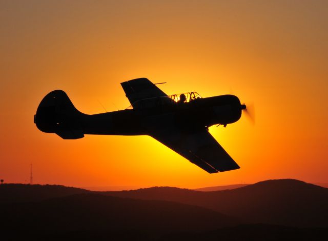 — — - Air-to-Air photo with a beautiful backdrop in Huntsville, Alabama.  The sun was easing down when pulled up in formation with this Yak 52. Photo plane was a Cessna 140. Photo: Blake Mathis