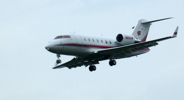 Canadair Challenger (N68UW) - About to touch down is this 2013 Bombardier Challenger 605 in the Summer of 2023.  "Go Badgers"