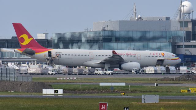 Airbus A330-300 (B-302D) - June 13, 2020 - Offloading PPE at Dublin. Swissport Using a Hi Loader for the Cargo in the Main Cabin.