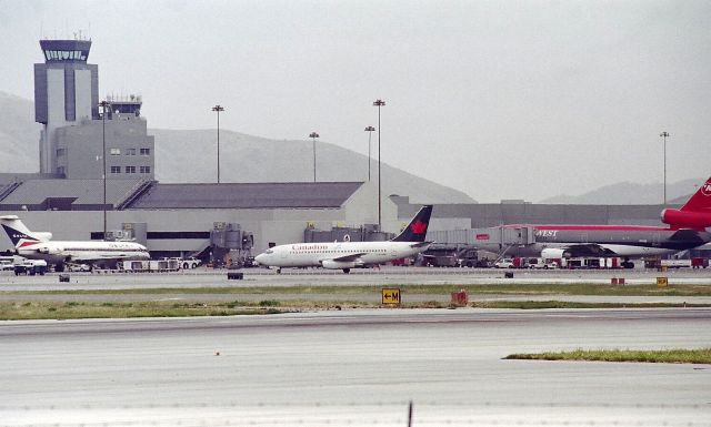 Boeing 737-200 — - KSFO - Millbrae Ave Airpark view pre 9/11....date apprx early 2000..now Mar 2017, the taller tower has been dismantled and the upper tower in this picture is being removed.