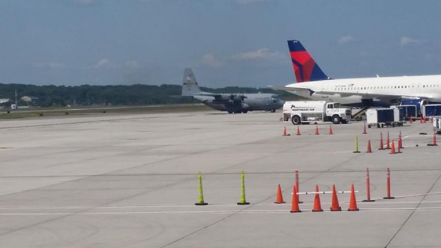 — — - A Military aircraft taxing at Portland, Maine