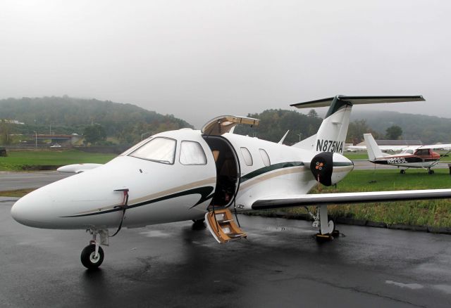 Eclipse 500 (N875NA) - At the RELIANT AIR ramp. They have the lowest fuel price on the Danbury (KDXR) airport.