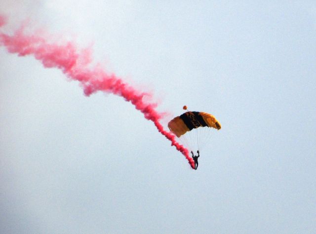 — — - U.S. Army sky divers over NHRA drag racing finals, Pomona, CA