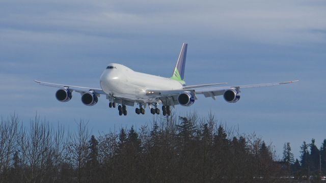 BOEING 747-8 (N770BA) - BOE573 on final to Rwy 34L to complete a ferry flight from KMJZ on 2.7.17. (ln 1437 / cn 37564). This was the first B748F that Boeing had in a "Seahawks" c/s.