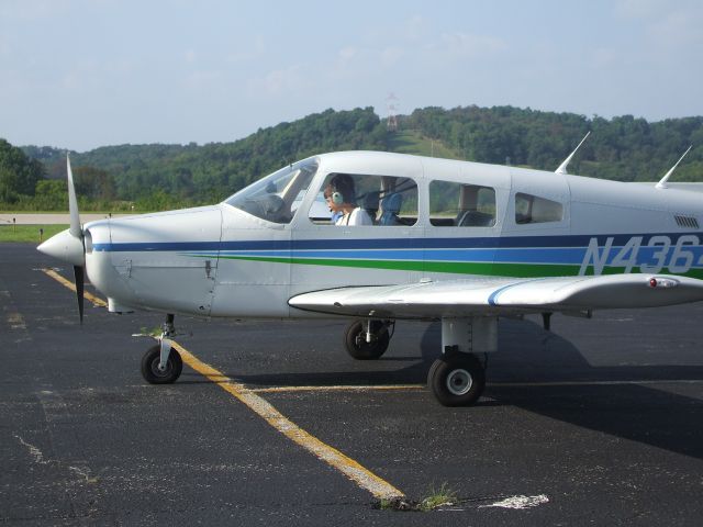 Piper Cherokee (N4364T) - PA-28-161 Warrior parked on main ramp at Washington County going over shutdown checklist.