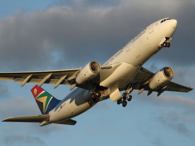 Airbus A330-200 — - Nice light catches this South African A330-200 just after rotation.