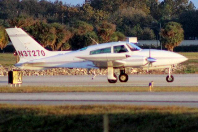 Cessna 310 (N37270) - Taxiing to depart rwy 7 on 2-Nov-16.