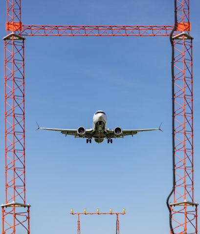 Boeing 737-700 (C-FSOC) - Through the uprights for the score! Air Canada Max 8 on short final at YOW