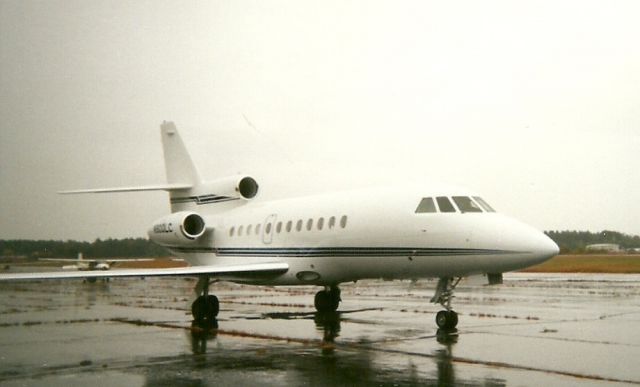 Dassault Falcon 900 (N900LC) - Falcon 900 getting wet on the ramp at Orange