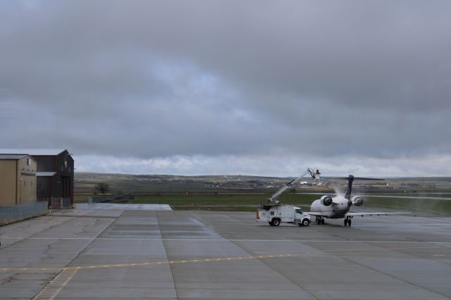 Canadair Regional Jet CRJ-700 (N156GJ) - From the observation deck at KCPR deicing