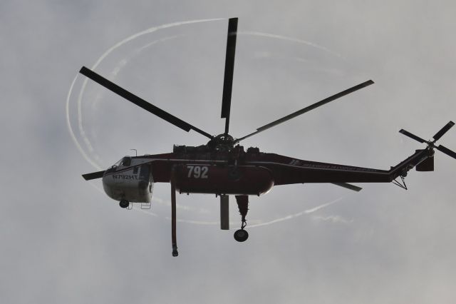 — — - I was covering a small wildland fire in the Oceano Dunes area of San Luis Obispo County, CA. Difficult terrain made it easier to access the fire from the air so Copter 792 was dispatched. After looking over all my photos I was struck by the contrails given off by the rotor tips...