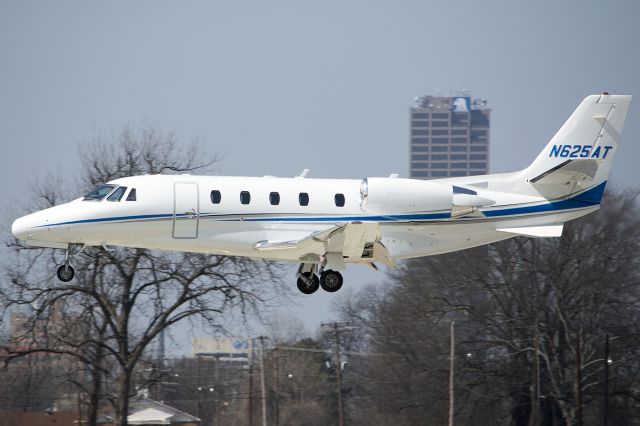 Cessna Citation Excel/XLS (N625AT) - About to touchdown on runway 18. - March 2014